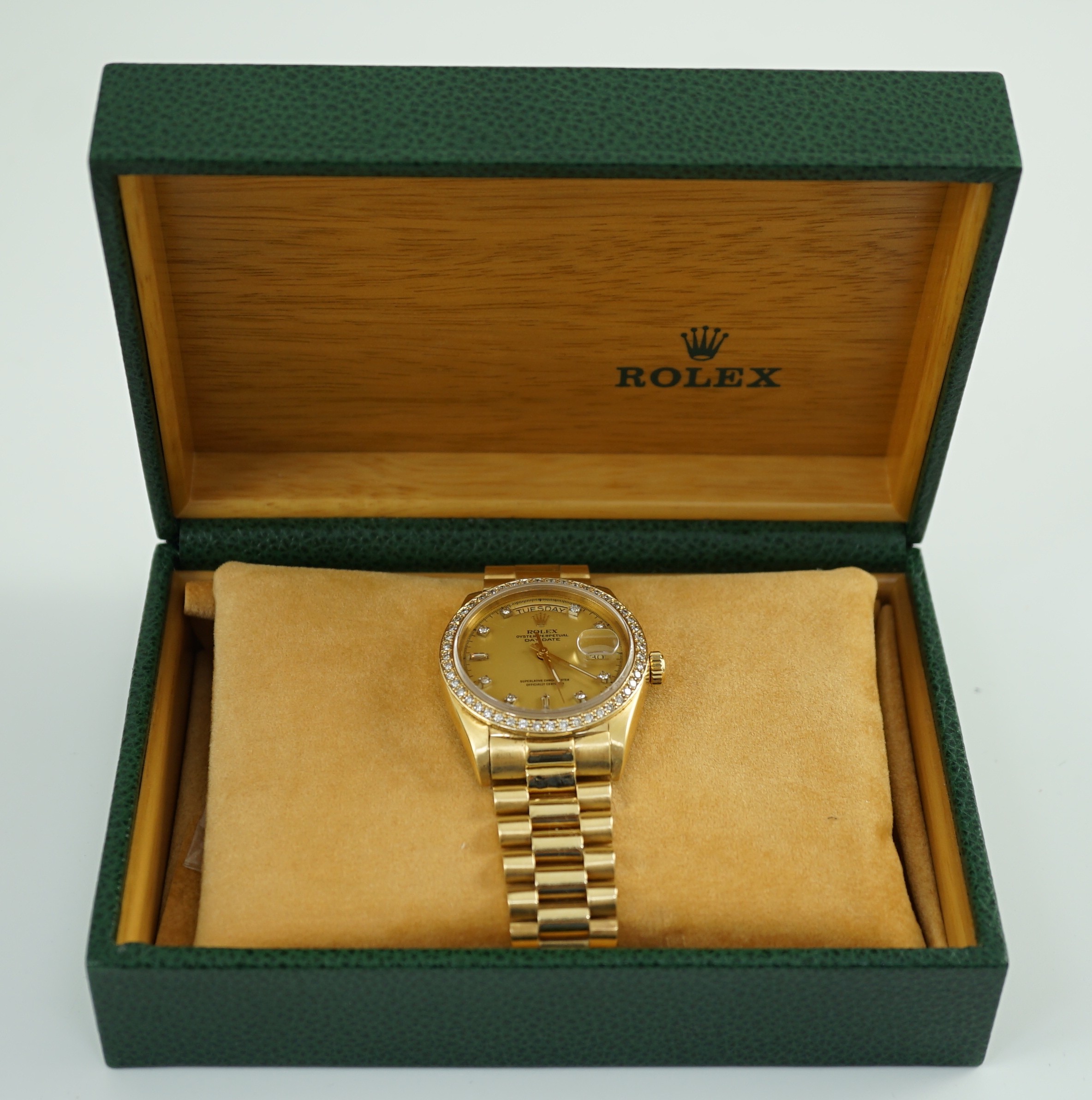 A gentleman's late 1970's 18ct gold Rolex Oyster Perpetual Day-Date wrist watch, with after market diamond set bezel and diamond set markers, on an 18ct gold Rolex bracelet with deployment clasp